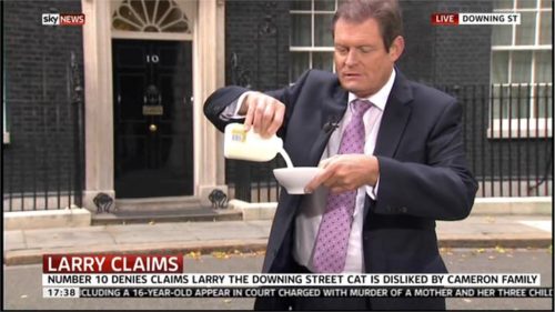 A Slow News Day.. Sky’s Jon Craig tempts Larry The Cat with Milk